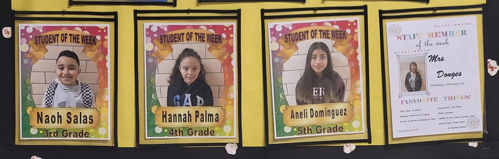 Photo of bulletin board featuring Students and Staff of the Month